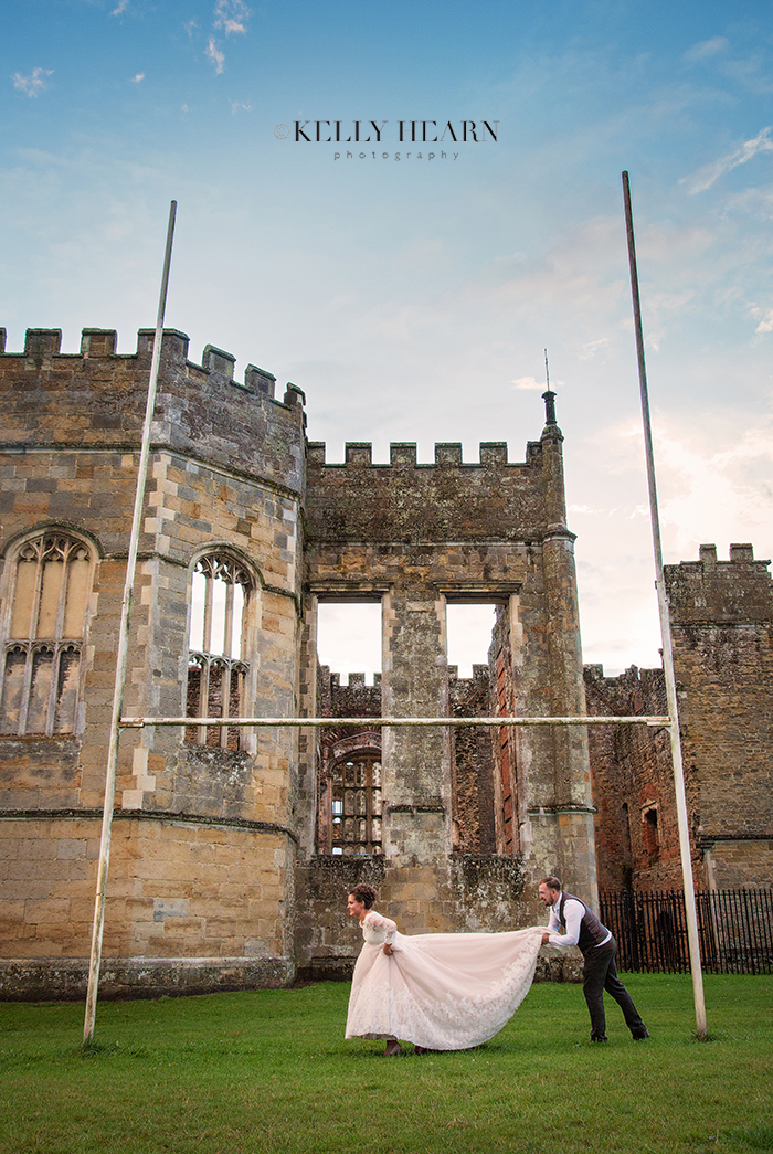 CAR_bride-groom-rugby-pose-ruins.jpg#ass