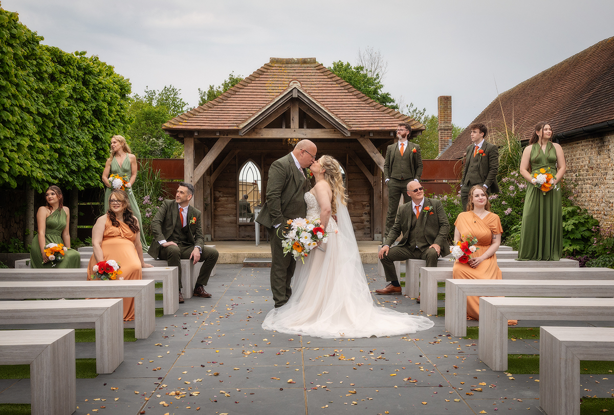 EVER_couple-kiss-bridalparty.jpg#asset:4631