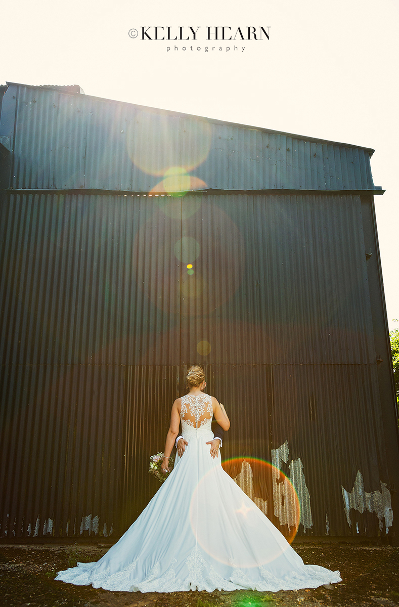 PAG_back-of-bride-barn-sun-flare.jpg#asset:2615