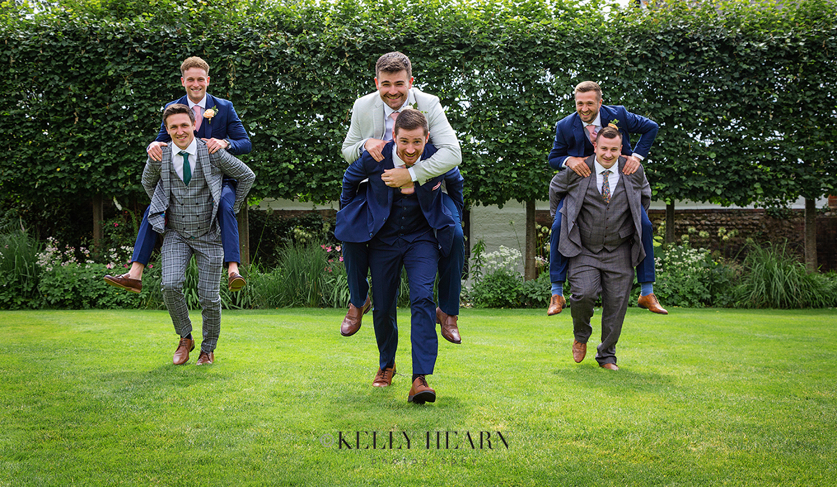 REE_groom-groomsmen-piggy-back.jpg#asset:3053