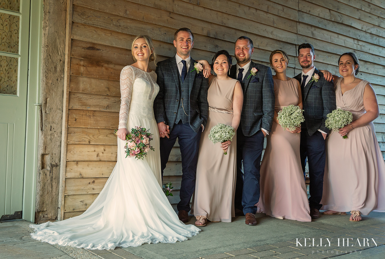 WALM_bridal-party-against-wooden-slats.jpg#asset:2476