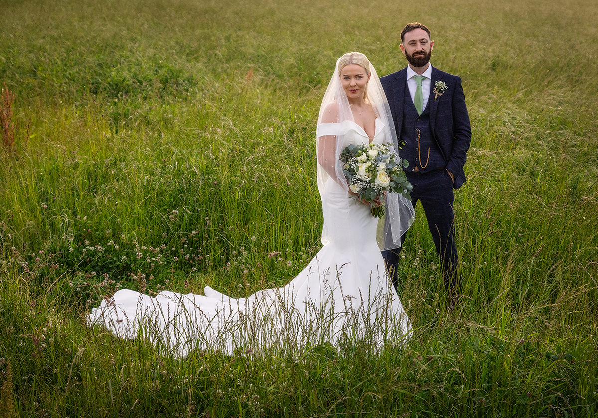 ANA_bride-groom-grass.jpg#asset:4198