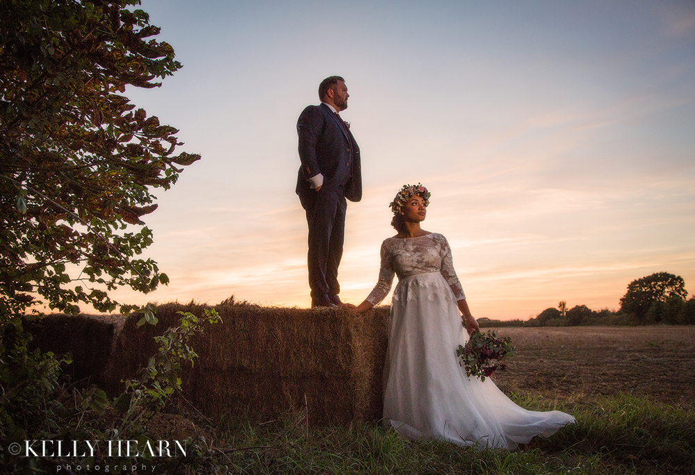 BOG_Couple-in-sunset-with-hay-bail.jpg#asset:2295
