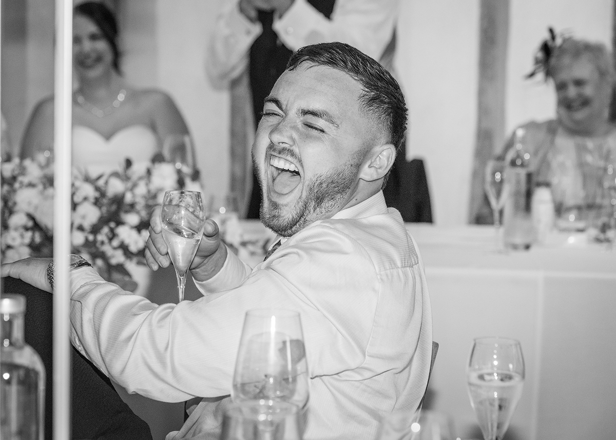 BRY_Reception_Laughter-groomsman.jpg#asset:4301
