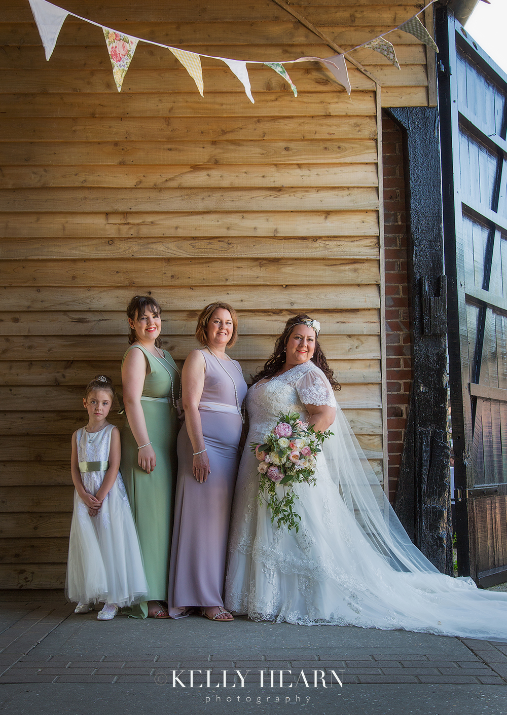 CAP_bride-bridesmaids-against-wooden-slats.jpg#asset:2051