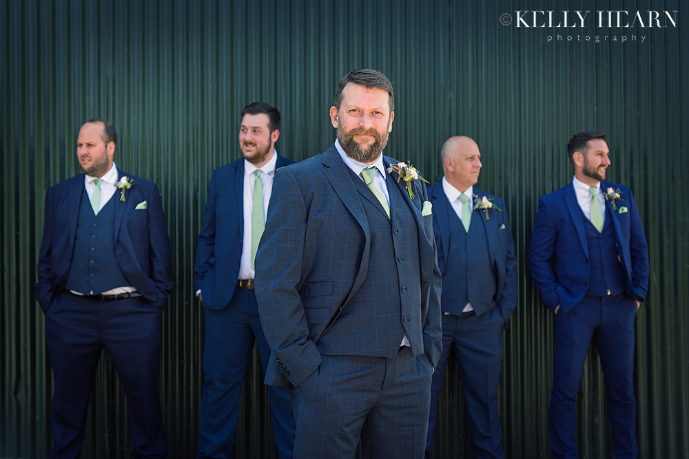 CAP_groom-groomsmen-against-green.jpg#asset:2055