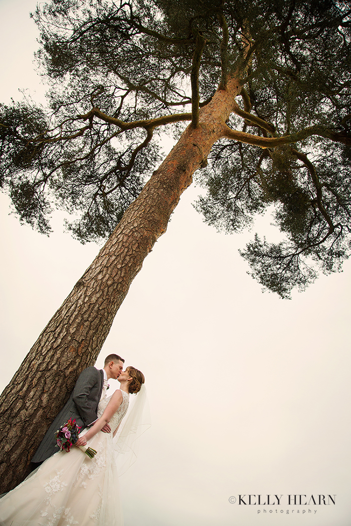 DOY_couple-by-tall-tree.jpg#asset:2072