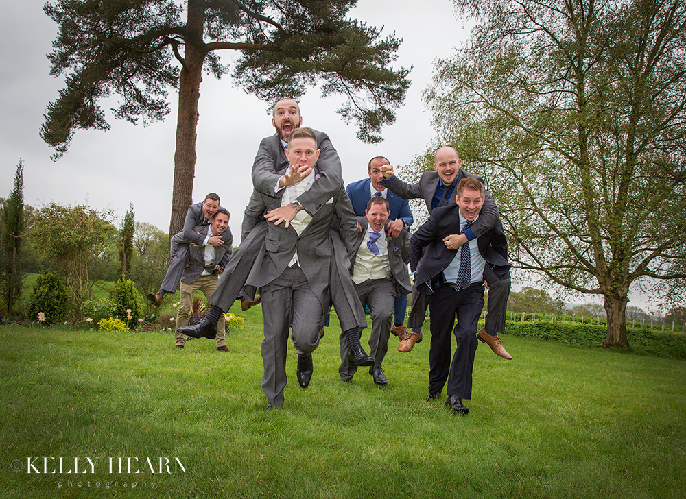 DOY_groom-piggybacks-with-groomsmen.jpg#asset:2075