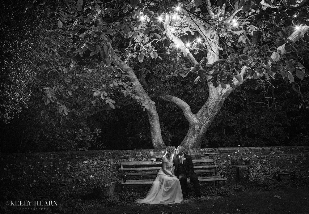 EDW_couple-on-bench-under-twinkling-tree.jpg#asset:1907
