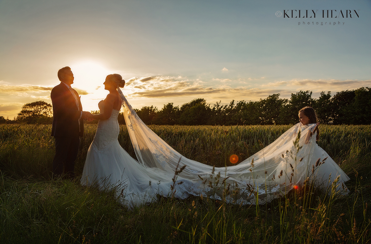 FRE_bride-groom-daughter-sunset-veil.jpg#asset:3060