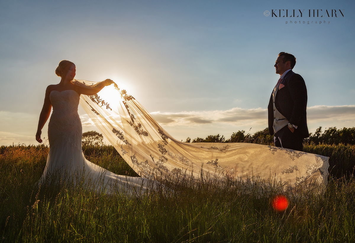 FRE_bride-groom-sunset-veil.jpg#asset:3065