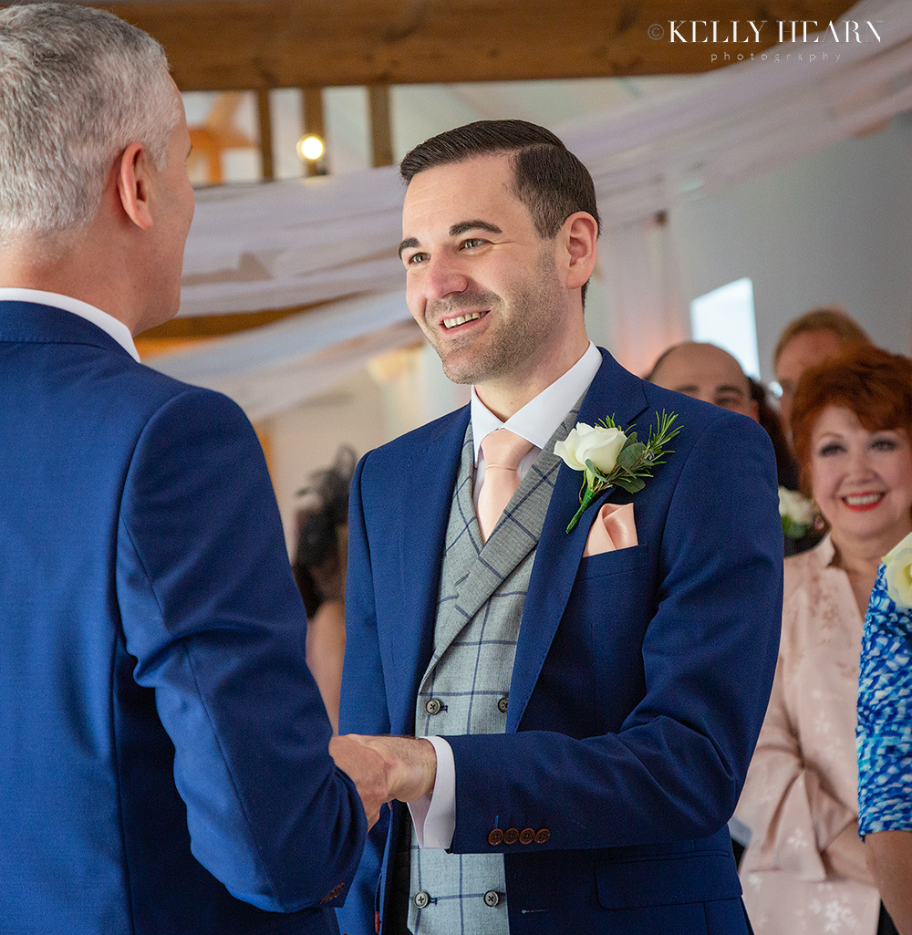 HAW_grooms-vows-holding-hands.jpg#asset:2559