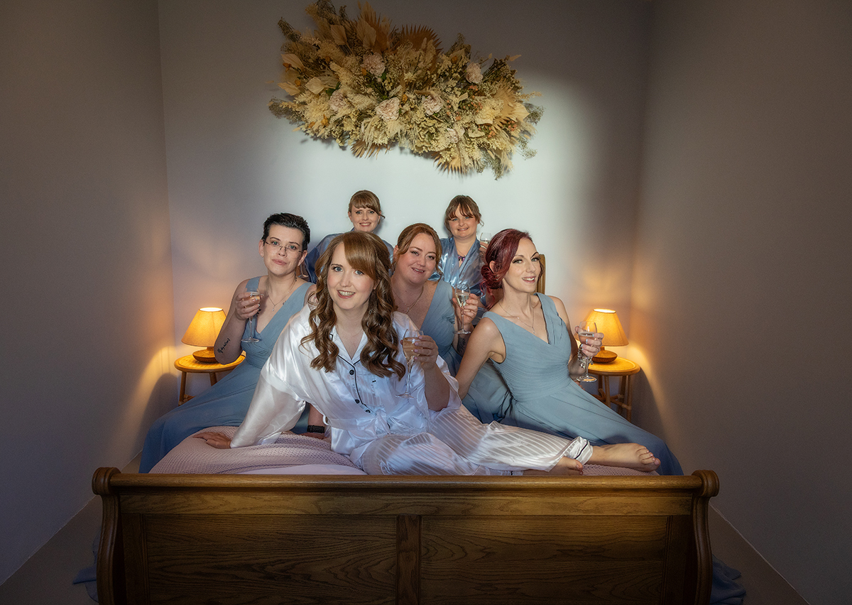 HOU_bride-bridesmaids-bed.jpg#asset:4531