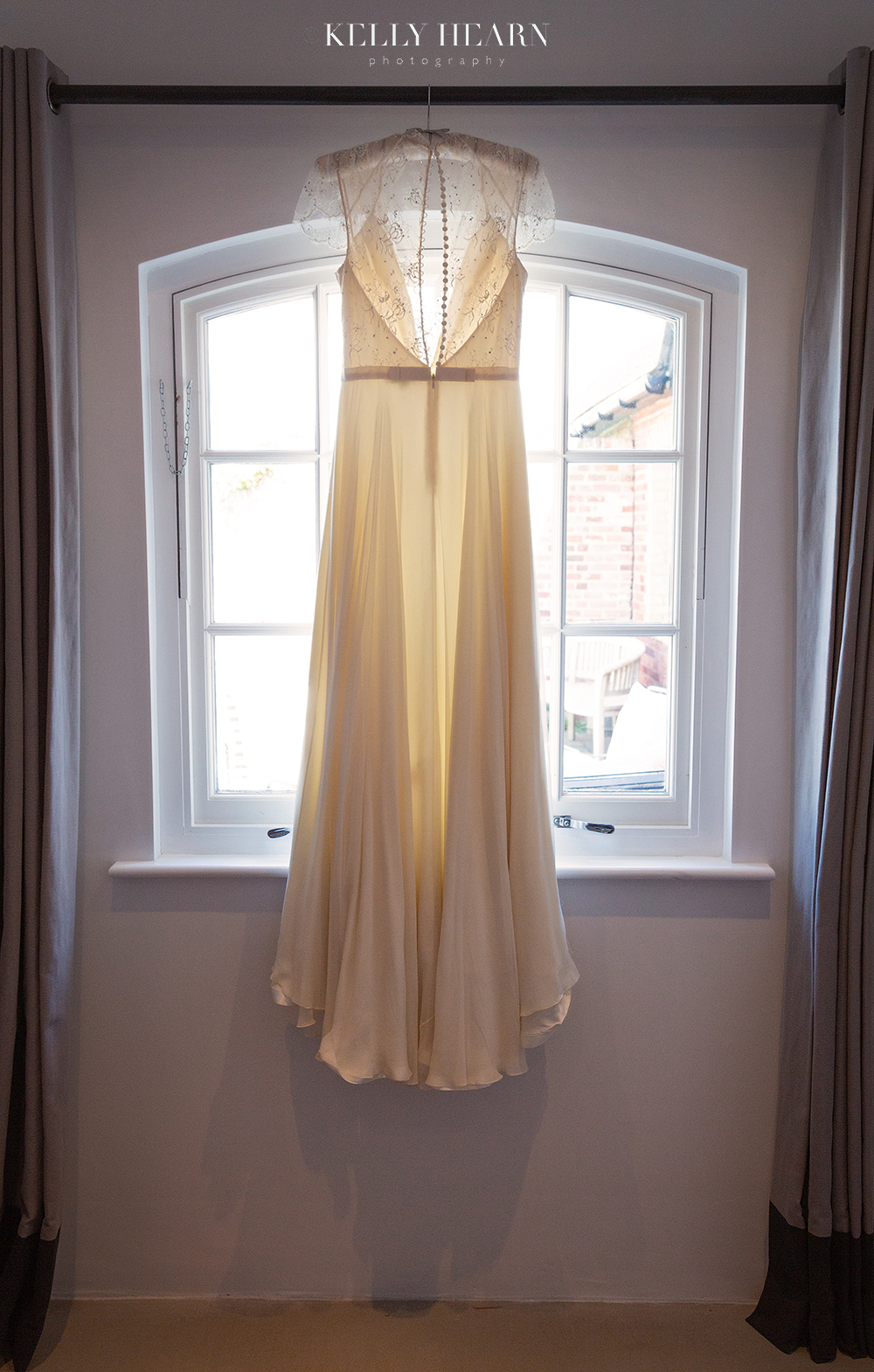 LEN_wedding-dress-hanging-at-window.jpg#asset:2586