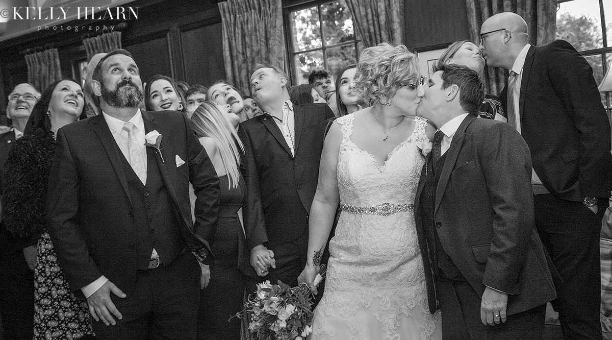 LEW_brides-kiss-and-guests-black-and-white.jpg#asset:2776