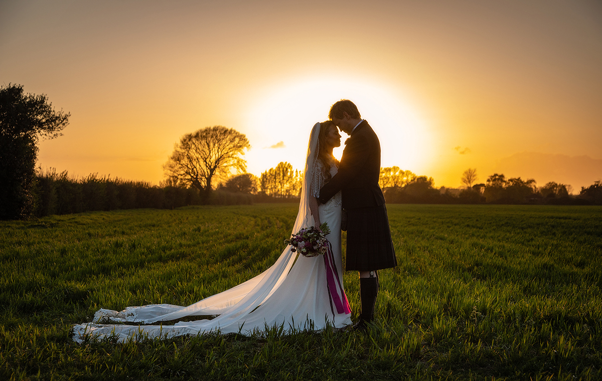 MCL_couple-sunset-field.jpg#asset:4606
